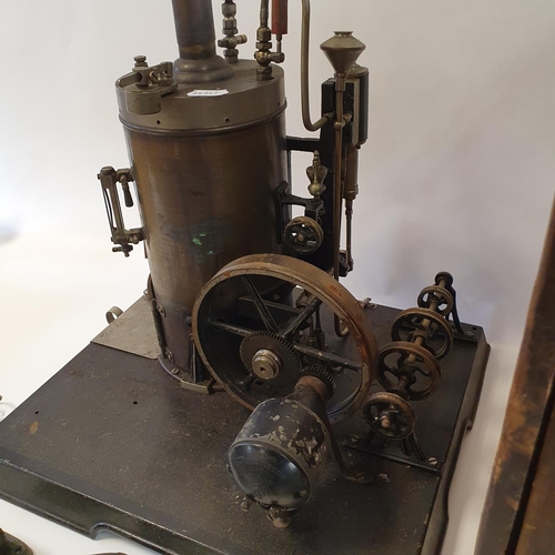 351 - An early/mid 20th century vertical steam engine, on a plinth base, with attached pulleys, 50 cm high... 