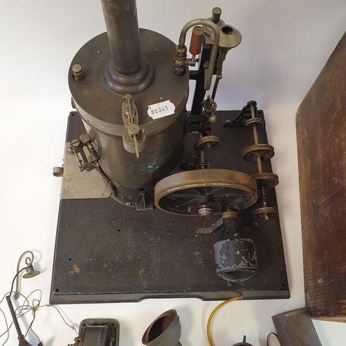 351 - An early/mid 20th century vertical steam engine, on a plinth base, with attached pulleys, 50 cm high... 