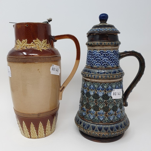 504 - A Doulton Lambeth jug and cover, decorated foliate forms, 26 cm high, a tobacco jar, 16 cm high and ...