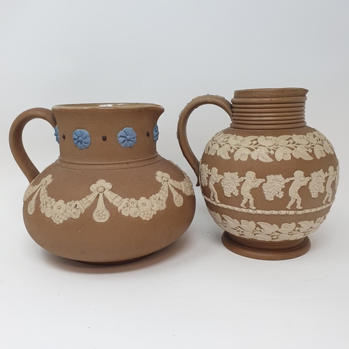 508 - A Doulton Lambeth tobacco jar, 15 cm high, and two Doutlon Lambeth jugs (3)...