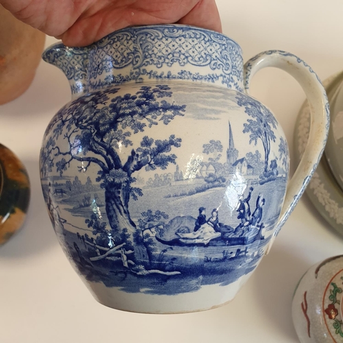 512 - A 19th century stoneware harvest jug, 27 cm high, a cheese dish and cover, and various other ceramic...