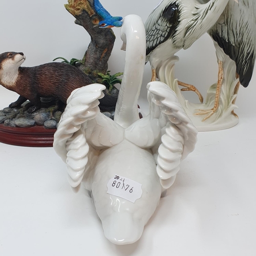 516 - A Lladro figure of a swan, a Border Fine Arts group, Friend or Foe and a Continental porcelain figur...