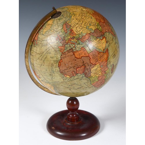 229 - A Geographica 10 inch terrestrial globe, with railways, on a turned wood stand,  38 cm high