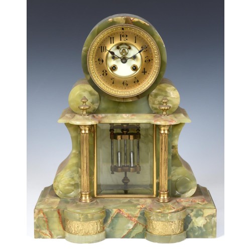 203 - A late Victorian mantel clock, the 10 cm diameter brass chapter ring with Arabic numerals, with expo... 