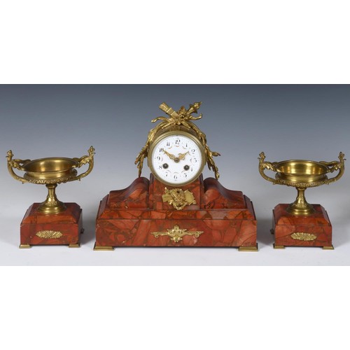 209 - An early 20th century clock garniture, the clock with an 11 cm diameter dial, in a gilt metal and re... 