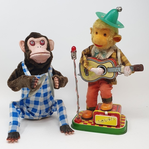 317 - A musical jolly chimp, boxed, and two other similar toys (3)