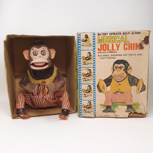 317 - A musical jolly chimp, boxed, and two other similar toys (3)