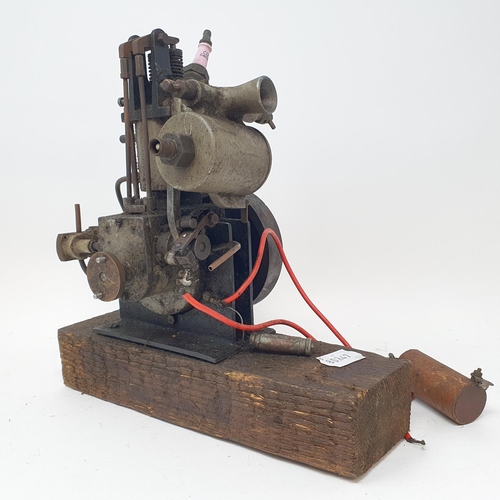 335 - A small single cylinder petrol engine, with a pulley wheel, possibly for powering a toy motor launch... 