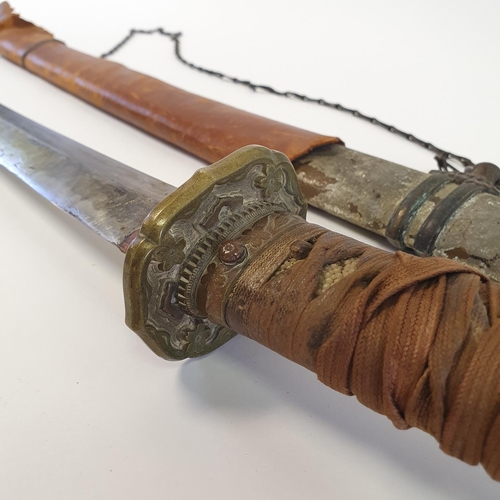 8 - A Japanese Katana, with a cord bound fishskin grip, in a painted metal scabbard
Provenance brought b...