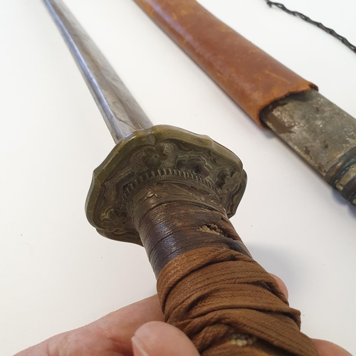 8 - A Japanese Katana, with a cord bound fishskin grip, in a painted metal scabbard
Provenance brought b... 