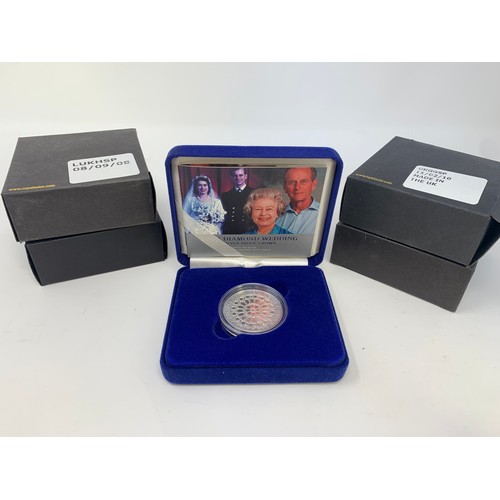 41 - A Diamond Wedding silver proof £5 coin, 2007, and others similar, all boxed...