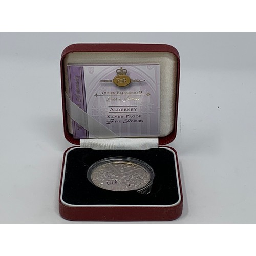 102 - An Alderney Concorde silver proof £5 coin, and other silver proof coins, all boxed