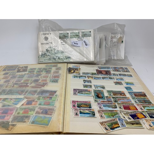 154 - A large group of world stamps, and First Day Covers, loose and in albums (2 boxes)