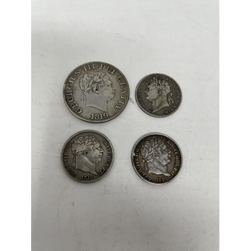 50 - A George III half crown, 1819, and three George III shillings (4)