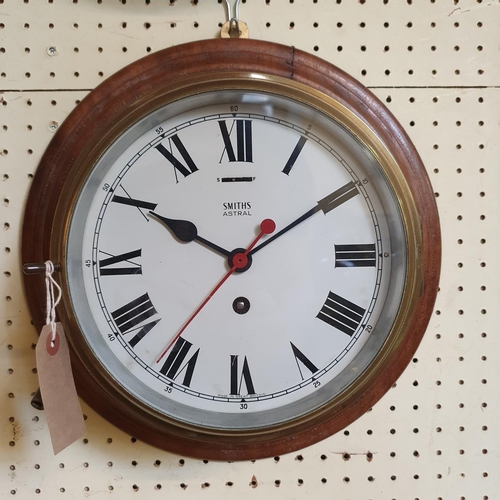 184 - A ships bulkhead type clock, the 18.5 cm diameter painted dial signed Smiths Astral, in a brass case... 