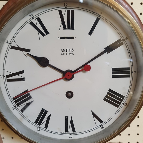 184 - A ships bulkhead type clock, the 18.5 cm diameter painted dial signed Smiths Astral, in a brass case... 