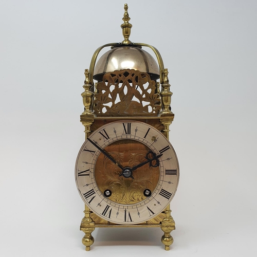 198 - A 17th century style lantern clock, the 11.5 cm diameter silvered chapter ring with Roman numerals, ... 