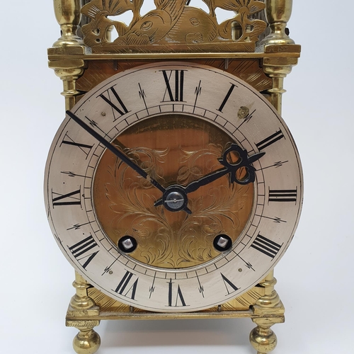 198 - A 17th century style lantern clock, the 11.5 cm diameter silvered chapter ring with Roman numerals, ... 