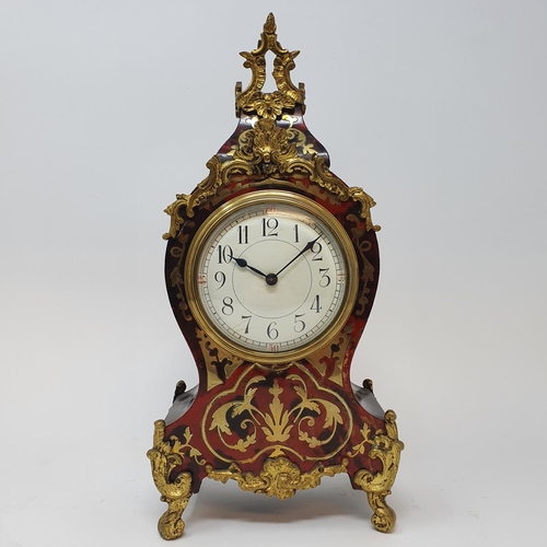 212 - A Louis XVI style mantel clock, the 8.5 cm diameter dial with Arabic numerals, fitted an eight day m... 