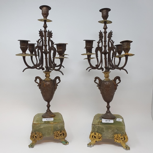 214 - A pair of spelter and onyx five light candelabra, from a clock garniture, 46.5 cm high (2)