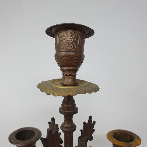 214 - A pair of spelter and onyx five light candelabra, from a clock garniture, 46.5 cm high (2)