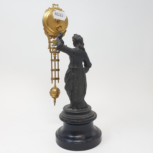 217 - An early 20th century mystery clock, mounted on a spelter figure, on a wooden base, 30 cm high (over... 