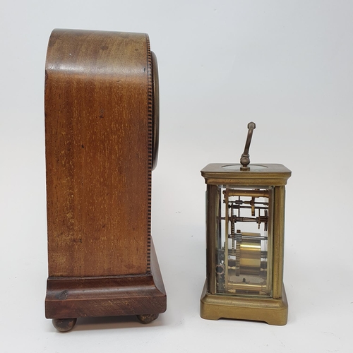 256 - An Edwardian mantel clock, in an inlaid mahogany case, 21.5 cm high, and a brass carriage clock (2)