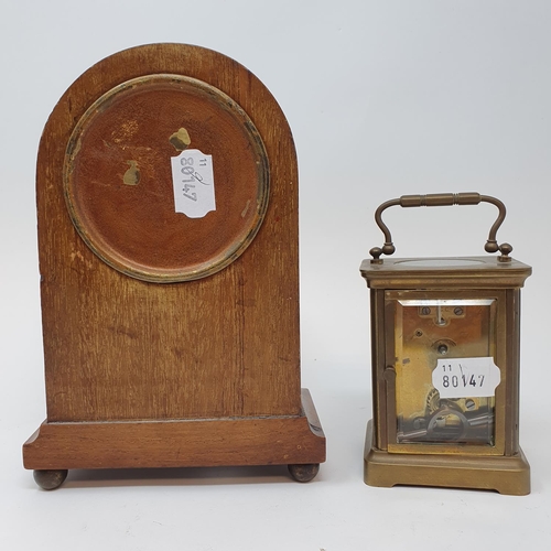 256 - An Edwardian mantel clock, in an inlaid mahogany case, 21.5 cm high, and a brass carriage clock (2)