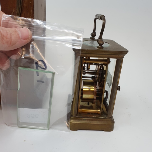 256 - An Edwardian mantel clock, in an inlaid mahogany case, 21.5 cm high, and a brass carriage clock (2)