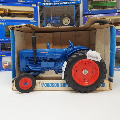 304 - An Ertl Fordson Super Major Tractor, boxed and various other model trucks and tractors, all boxed (b... 