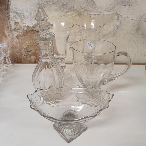 524 - A 19th century cut glass jug, 26 cm high, a set of four Waterford cut glass tumblers, a blue and whi...