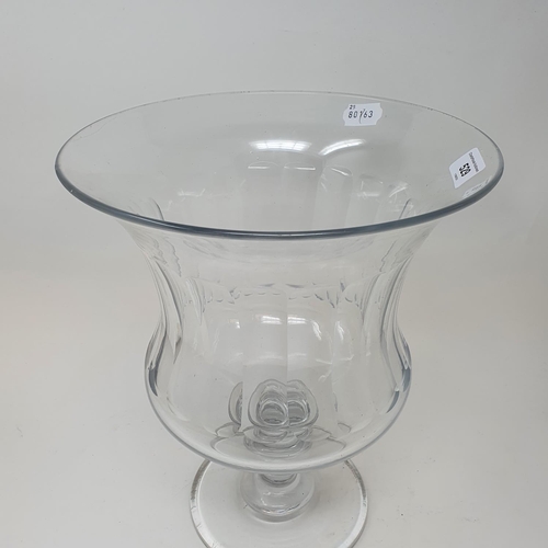 529 - A large glass goblet vase, on a round foot, 34 cm high x 27 cm diameter...