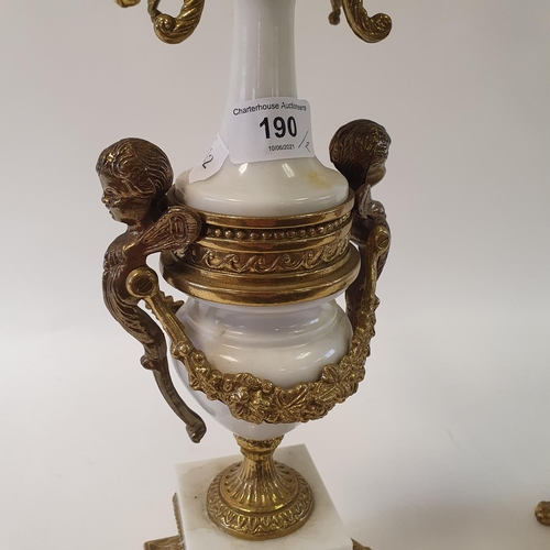 190 - A pair of Victorian style gilt metal seven light candelabra, from a clock garniture, 68 cm high (2)