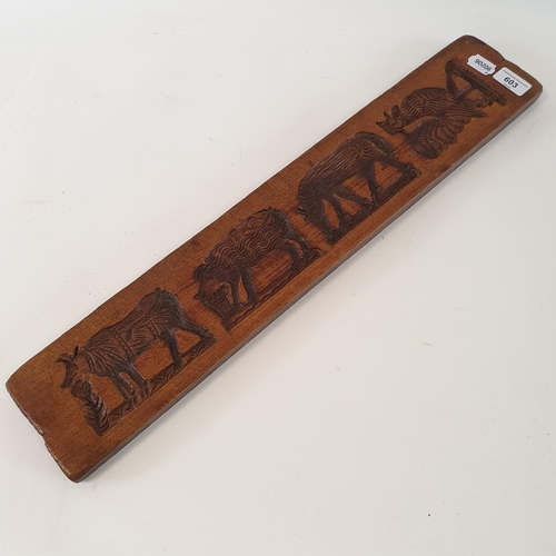 603 - A treen gingerbread mould, 62 cm