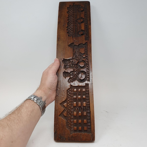 605 - A treen gingerbread mould, 50 cm