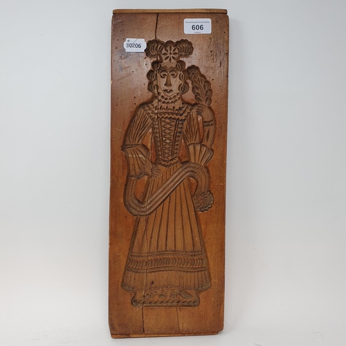 606 - A treen gingerbread mould, 48 cm