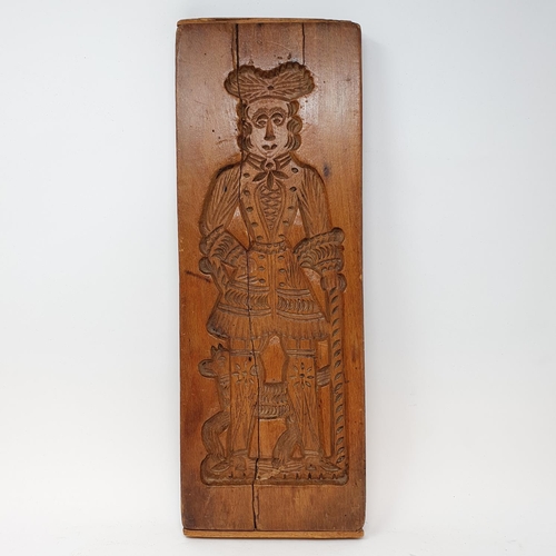 606 - A treen gingerbread mould, 48 cm