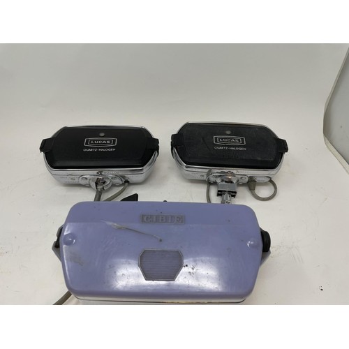 9 - A pair of Lucas Quartz-Halogen driving lamps, with covers, a Cibie driving lamp, with a cover, and a... 