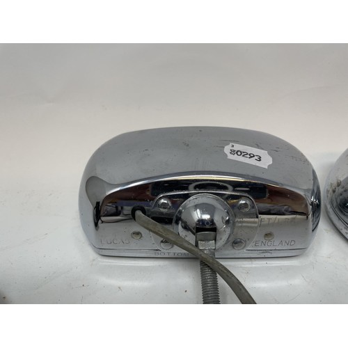 9 - A pair of Lucas Quartz-Halogen driving lamps, with covers, a Cibie driving lamp, with a cover, and a... 