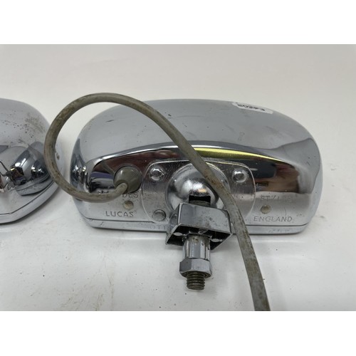 9 - A pair of Lucas Quartz-Halogen driving lamps, with covers, a Cibie driving lamp, with a cover, and a... 