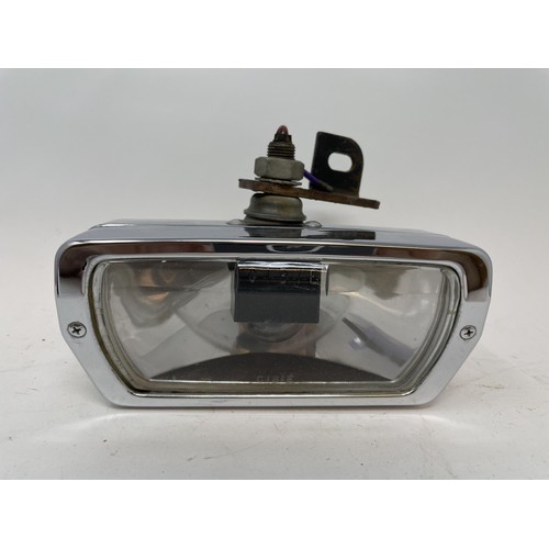 9 - A pair of Lucas Quartz-Halogen driving lamps, with covers, a Cibie driving lamp, with a cover, and a... 
