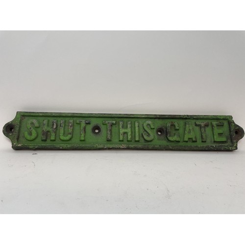 51 - A cast iron sign PENALTY FOR NEGLECT £2, 52 cm wide, another similar, SHUT THIS GATE, 42 cm wide, bo... 