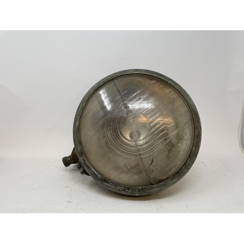 40 - Four headlamps, understood to be from a pre-war Ford, and four other headlamps (2 boxes)