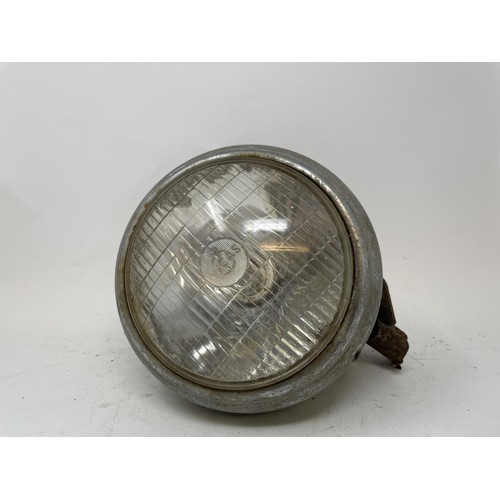 40 - Four headlamps, understood to be from a pre-war Ford, and four other headlamps (2 boxes)