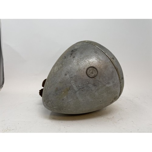 40 - Four headlamps, understood to be from a pre-war Ford, and four other headlamps (2 boxes)