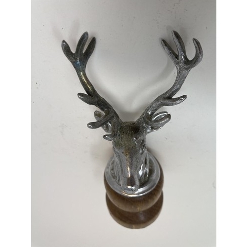 46 - A chrome car mascot, in the form of a stag, a chrome Jaguar leaping cat car mascot, and another masc... 