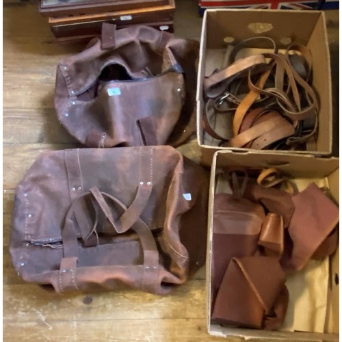 60 - *** withdrawn ****
A canvas shotgun case, two leather bags, various leather bolts (2 boxes)