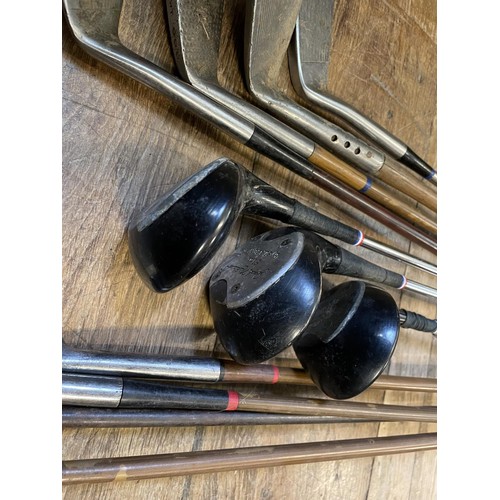 63 - Assorted sporting items, including tennis racquets, squash racquets, golf clubs, cricketing and othe... 