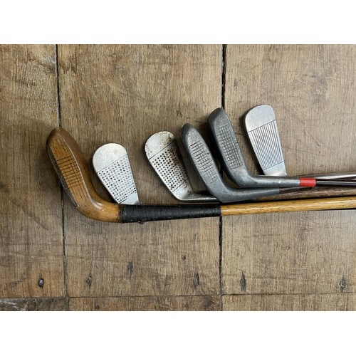 64 - Assorted vintage golf clubs (qty)