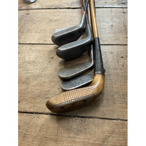 64 - Assorted vintage golf clubs (qty)